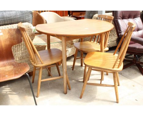 A MODERN 36" DIAMETER DROP-LEAF KITCHEN TABLE AND THREE ERCOL STYLE CHAIRS 