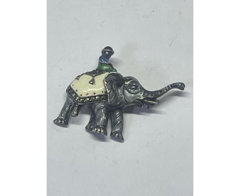 A 1940'S SILVER, ENAMEL AND MARCASITE ELEPHANT AND RIDER BROOCH 