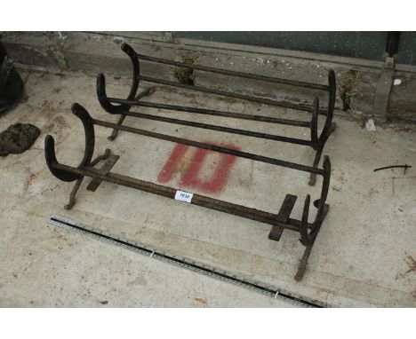TWO VINTAGE METAL SHOE RACKS WITH HORSE SHOE ENDS 