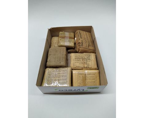 Ten WWII (dated) first aid dressings with an A.R.P. example
