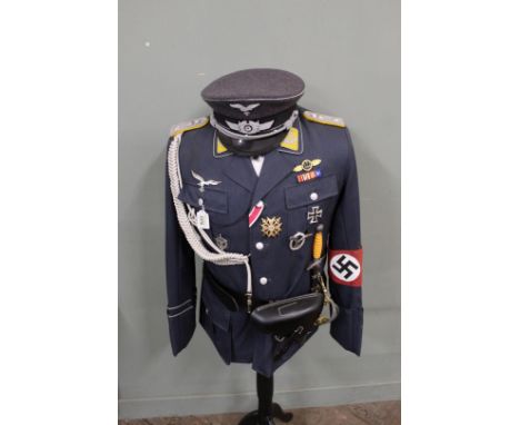 A reenactors German (PATTERN) Luftwaffe Officers tunic and cap, complete with Luger holster, dress dagger and insignia comple