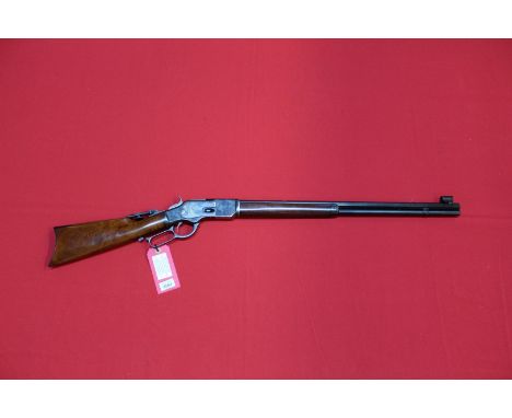 A 44/40 lever action rifle by Uberti, model 1873 sporting rifle, S/No.59706. 24 1/4" octagonal barrel with specialist apertur