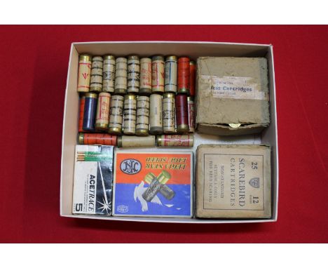 A mixed lot of mainly military issue 12 bore cartridges with tracer and 'scarebird' examples, this item can only be purchased