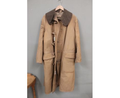 A WWII cold weather coat, label reads 'Coat Kapok Lined, Size 3' etc, made by Wareings (N'ton) Ltd 1943 and broad arrow, the 