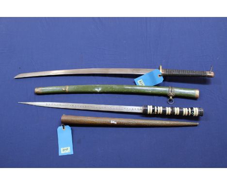 An ethnic sword with ornate grip and copper covered scabbard with a decorative 'Japanese style' sword and scabbard