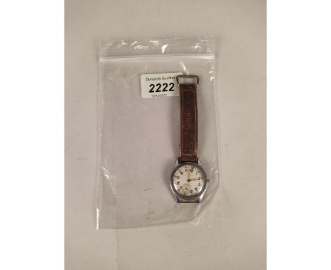 A WWII era Timor military wristwatch, back marked A.T.P. 15021 (and broad arrow) (as found, missing crown)
