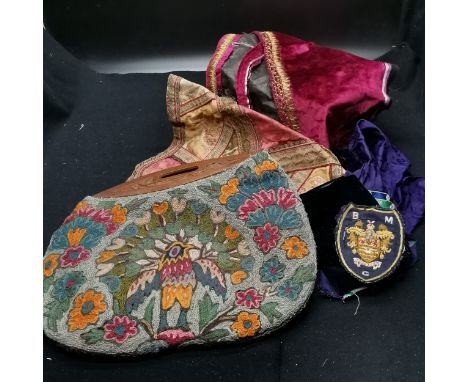 Pieces of old fabric and tapestry bag with wooden handle. 