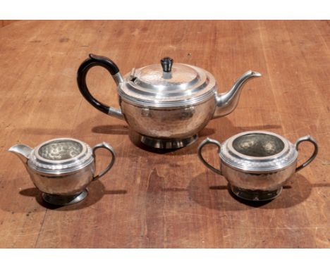 A three piece pewter tea service
