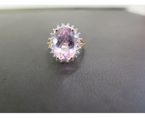 A 9ct gold kunzite and white-gem cluster ring - Hallmarked Birmingham - Ring size N 1/2 - Weight approx 4.8gms
Condition Repo