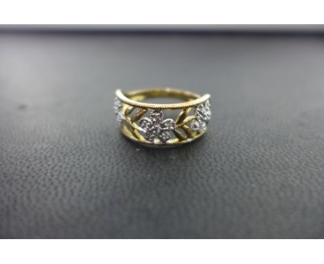 A 9ct gold floral diamond band ring - Hallmarked Birmingham - Ring size N - Weight approx 2.8gms
Condition Report: Good - Wit