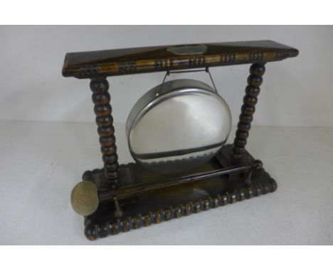 An early 20th century oak framed gong with bobbin supports on a rectangular carved base - 24cm x 30cm