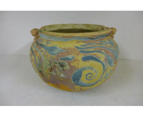 A stoneware twin handled Art vase by Carlos van Reigersberg-Versluys, decorated in polychrome with swirls and stylized foliag