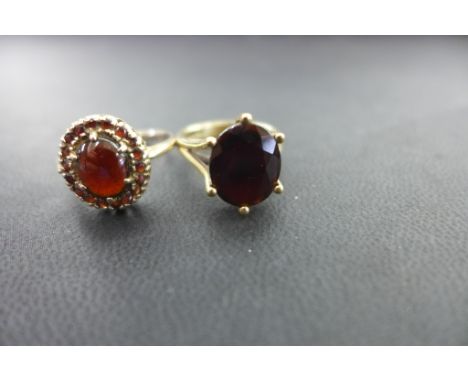 Two 9ct gold garnet rings - To include a single-stone and a cluster - Hallmarked Birmingham - Ring size K 1/2 and P - Weight 