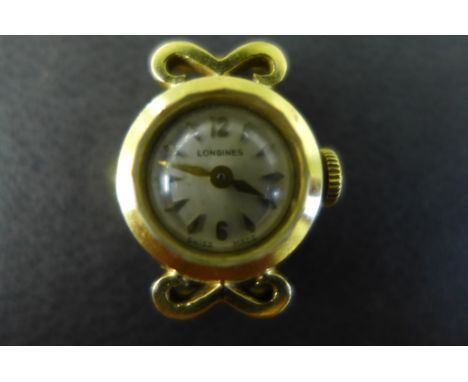 A ladies 18 ct gold Longines Cocktail watch head with metallic dial having stick markers and Arabic applied numerals, the cas