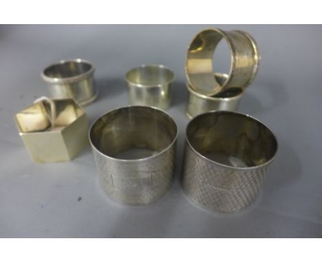 A pair of Edward VIII engine turned silver napkin rings - Birmingham 1945 and five others with mixed dates - Weight approx. 6