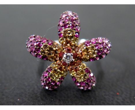 A diamond and multi-gem flower ring - Designed as a brilliant-cut diamond to the pave-set gem petals - Diamond weight 0.10ct,