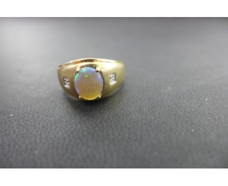 An imitation opal and diamond ring - Stamped 10k - Ring size P 1/2 - Weight approx 3.5gms
Condition Report: Good to fair - Wi