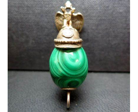 A malachite charm - The malachite bead surmounted by a silver gilt Russian military helmet and double headed eagle - Length 5