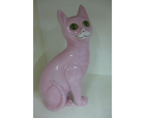 A Galle style ceramic cat, probably 1940's the seated grinning feline having green glass eyes - Height 34 cm