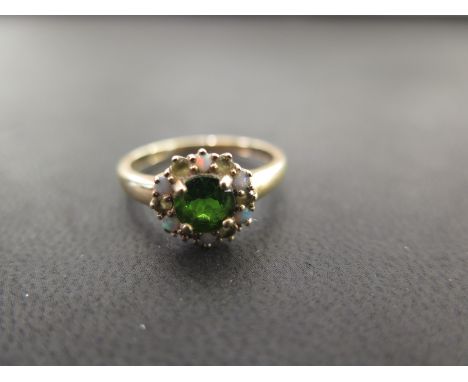 A 9ct gold chrome diopside, opal and gem cluster ring - Hallmarked Birmingham - Ring size R 1/2 - Weight approx 2.3gms
Condit
