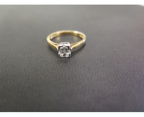 An 18ct gold emerald-cut diamond single-stone ring - Diamond weight 0.50ct, stamped to band - Estimated L-tinted colour, VS2-