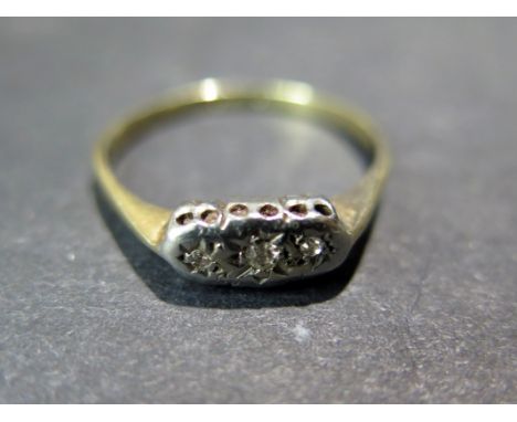 A 9ct gold three stone diamond ring - Size N - Weight approx. 1.5gms
Condition report: Minor wear