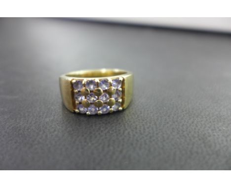 A 9ct gold tanzanite panel ring - Hallmarked Birmingham - Ring size T 1/2 - Weight approx 7.1gms
Condition Report: Good - Wit