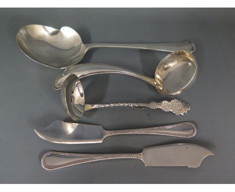 A silver hallmarked Toddy ladle, a large silver spoon, two fish knives and another ladle - Weight approx. 6.7 troy oz - Conti