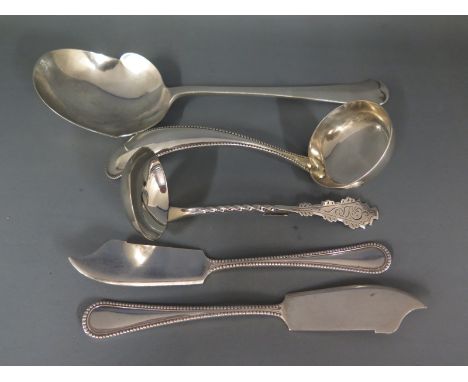 A silver hallmarked Toddy ladle, a large silver spoon, two fish knives and another ladle - Weight approx. 6.7 troy oz - Conti