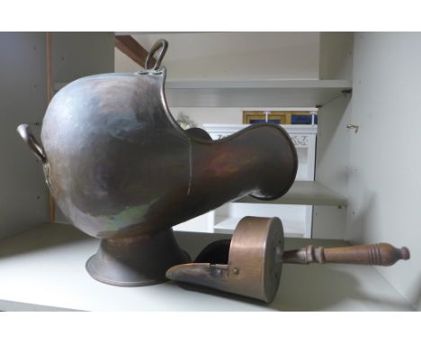 A Victorian copper coal helmet with two handles on a circular foot and similar coal scoop with wooden handle
Condition report