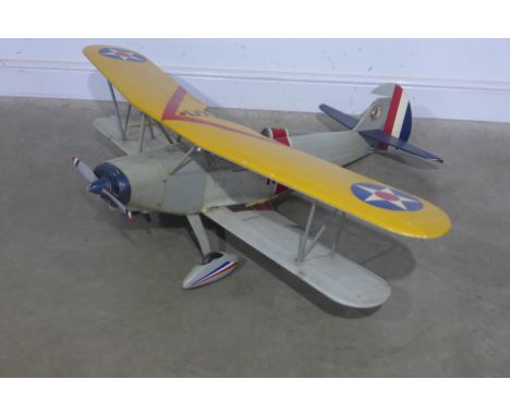 A remote control model bi-plane, petrol engine with multicoloured insignia and flags - 38cm x 145cm x 110cm
Condition report: