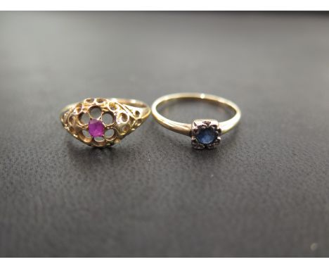 A ruby openwork flower ring - Tests as higher carat gold - Ring size M - Weight approx 2.5gms - Together with a sapphire sing