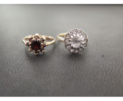 Two cluster rings - To include garnet and white-gem - Both with marks indicating 9ct gold - Ring sizes J 1/2 and K - Weight a