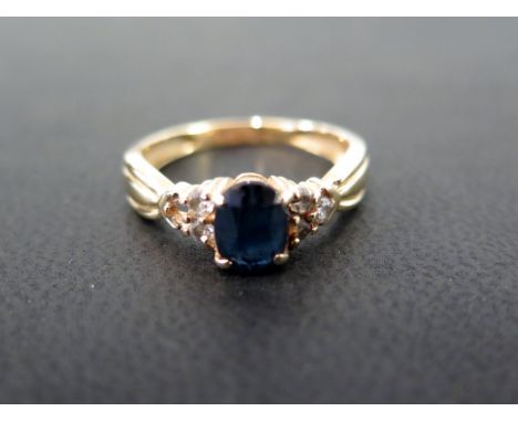 A sapphire and diamond dress ring - Tests as higher carat gold - Ring size N - Weight approx 3.2gms
Condition Report: Fair - 