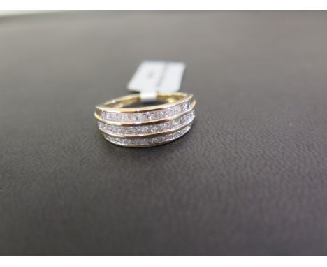 A 9ct gold princess-cut diamond three-row ring - Estimated total diamond weight 1.0ct Hallmarked Birmingham - Ring size N 1/2