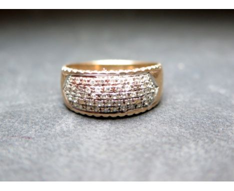 A 9ct gold pave-set diamond band ring - Diamond weight 0.25ct, stamped to band - Hallmarked London - Ring size O 1/2 - Weight