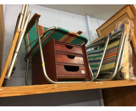 Shelf of retro camping chairs