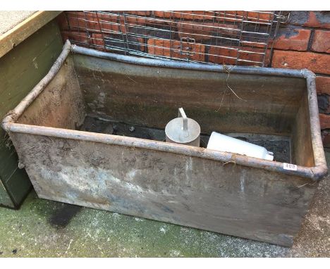 A galvanised trough, chicken feeder etc.