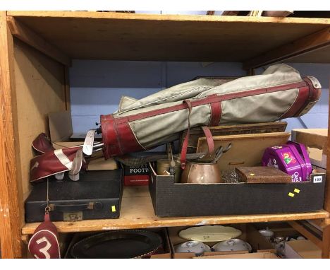 Shelf of assorted, golf clubs, typewriter, metal ware etc.