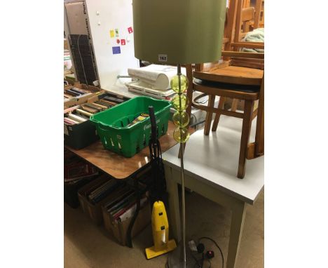 Standard lamp and an Electrolux Super Broom