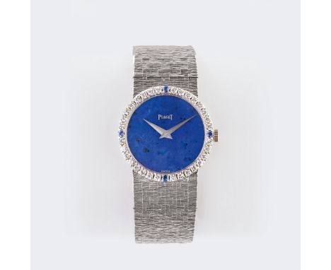 Piaget. Damen-Armbanduhr mit Lapislazuli und Diamanten. 18 kt. WG, gest., Handaufzug, Ref. 9706A6. Blaues Lapislazuli Zifferb