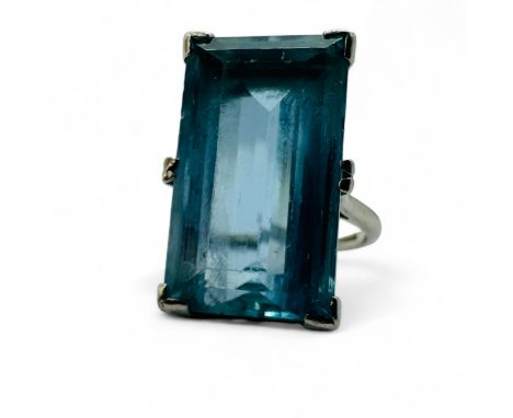 An estimated 13.49 carat Art Deco style aquamarine cocktail ring. Set with a rectangular step cut aquamarine, measuring 20.25