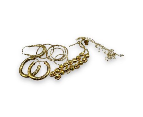 A collection of gold jewellery to include a pair of cultured pearl earrings in 18ct gold. Also comprising four pairs of 9ct g