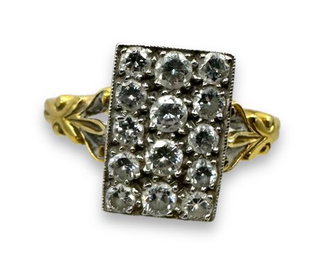 An 18ct gold diamond panel ring. Featuring a rectangular panel pave set with 14 round brilliant cut diamonds - four estimated