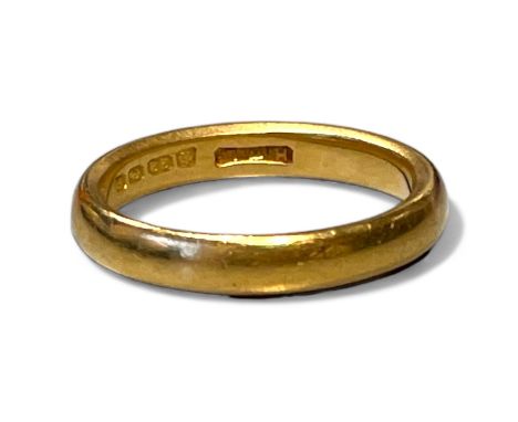 A 22ct gold band ring. SIze O. Approximate weight 6.08 grams.&nbsp;