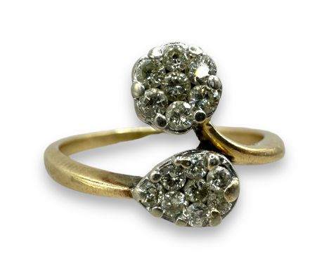 A diamond cluster crossover ring in yellow precious metal. Featuring a circle and tear drop "toi et moi" style motif. Size R.