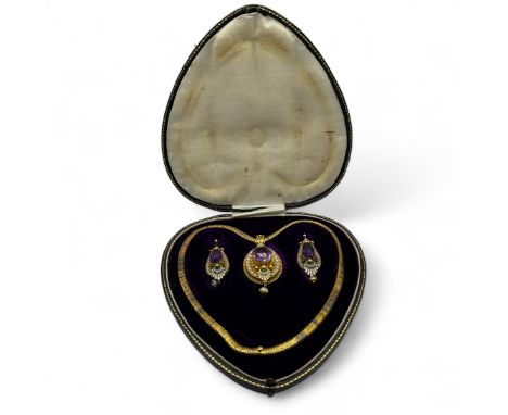 A suite of enamel and enamelled Victorian Egyptian revival style jewellery. Comprising an amethyst locket pendant, with a gla