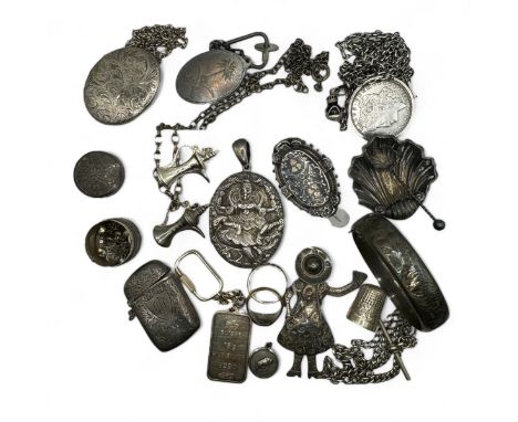 A collection of antique and vintage silver jewellery. Featuring an Indian embossed locket, an aesthetic movement brooch, a gi