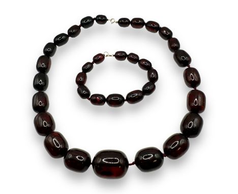Cherry amber-type bead necklace and bracelet. Featuring a strand of graduated Oval beads, approximately 55cms. Featuring a 37