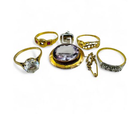 A collection of gold jewellery. Comprising an amethyst brooch, stamped "9ct" and testing accordingly, a 9ct gold cubic zircon